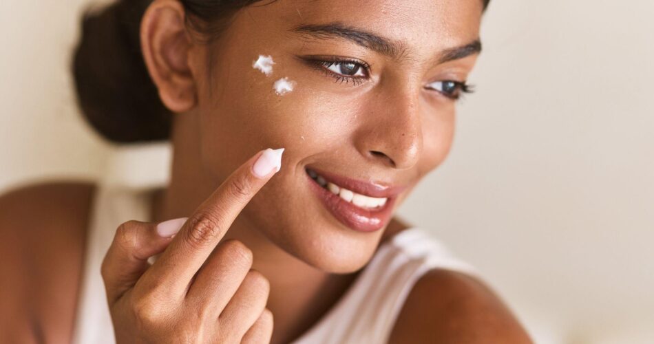skincare-woman-applying-moisturizer-to-face